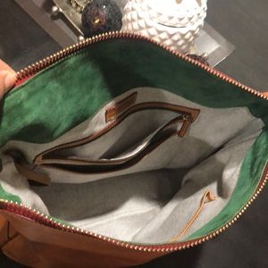 Dooney & Bourke large cross body with cloth strap.